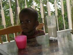 Little boy gets his glass of milk