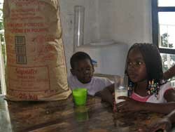 Children in an orphanage are supplied with milk