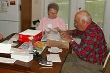 President Joe Krentz and wife Loretta working on bi-annual newsletter mail out